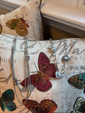 Stunning pair of Rebecca IT silver plated necklaces.